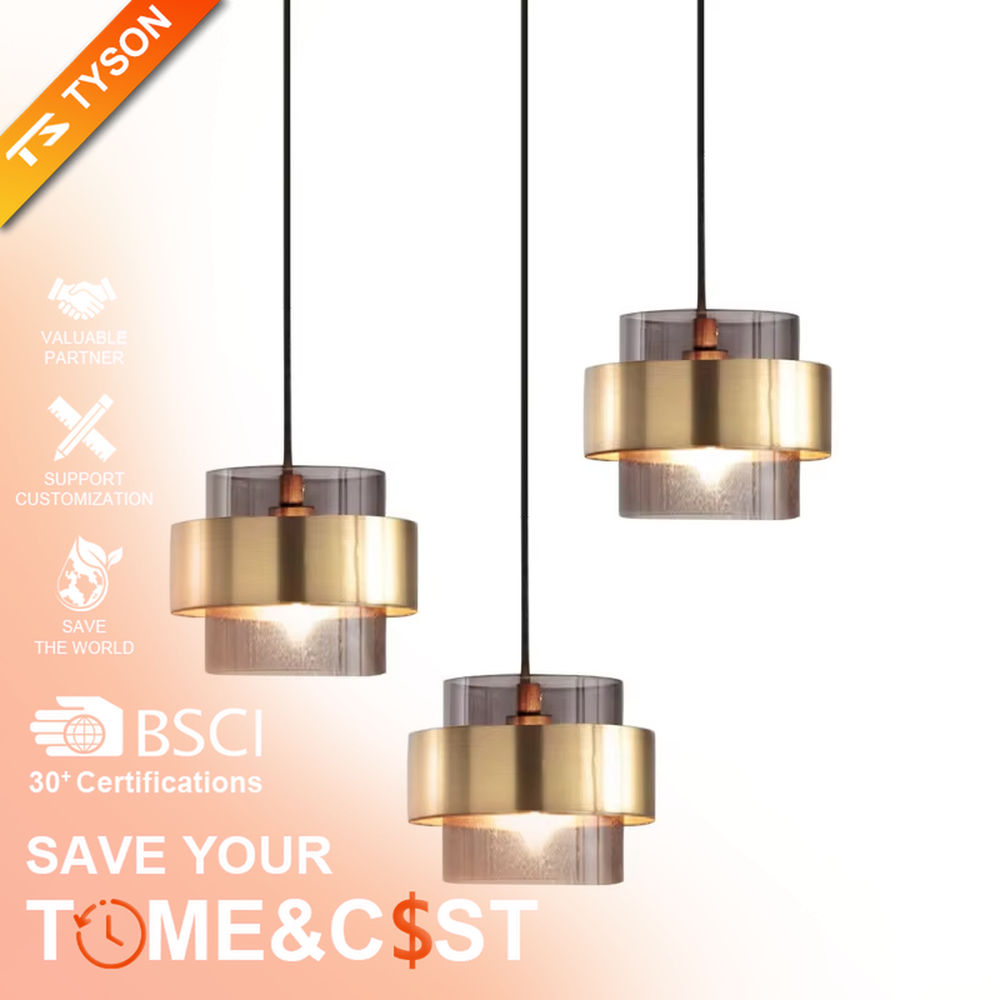 Light luxury gold ring glass triple chandelier (transparent glass lampshade + gold metal ring + black hanging wire with gold base), warm light effect, creating a modern and high-end kitchen and dining space atmosphere.