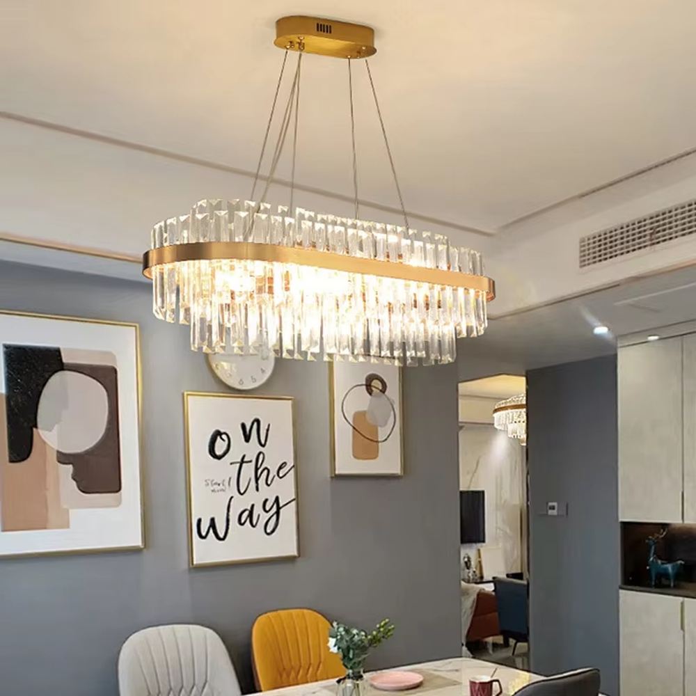 This is a light luxury style multi-layer circular crystal chandelier, featuring a gold metal frame paired with transparent cut crystal strips. The light refracts through the crystals to create a brilliant and luxurious lighting effect, serving both lighting and decorative purposes, and is suitable for quality-focused scenarios such as villa living rooms, duplex high-ceiling spaces, hotel lobbies, and high-end restaurants.