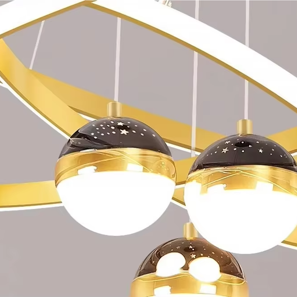 This modern light luxury galaxy-shaped chandelier features multi-layer interlaced ring light strips made of black and gold metal, paired with spherical crystal lamp shades, and has a built-in star and moon projection effect on the top. It serves both lighting and decorative purposes, ideal for modern home spaces such as living rooms and dining rooms, as well as light luxury commercial venues.