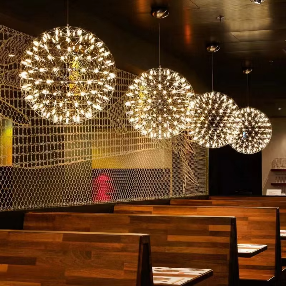 Art spark ball dandelion chandelier (metal woven spherical frame + built-in LED light source), warm/cool light effect, creating a dreamy and bright high-ceiling space atmosphere.