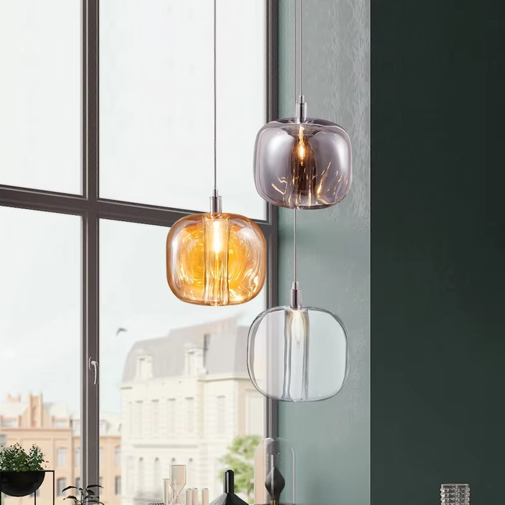 Light luxury multi-color textured glass ball combination hanging lamp, dark green/gold/silver textured glass balls + thin suspension ropes, warm light refracts a flexible texture, creating a light luxury artistic atmosphere.