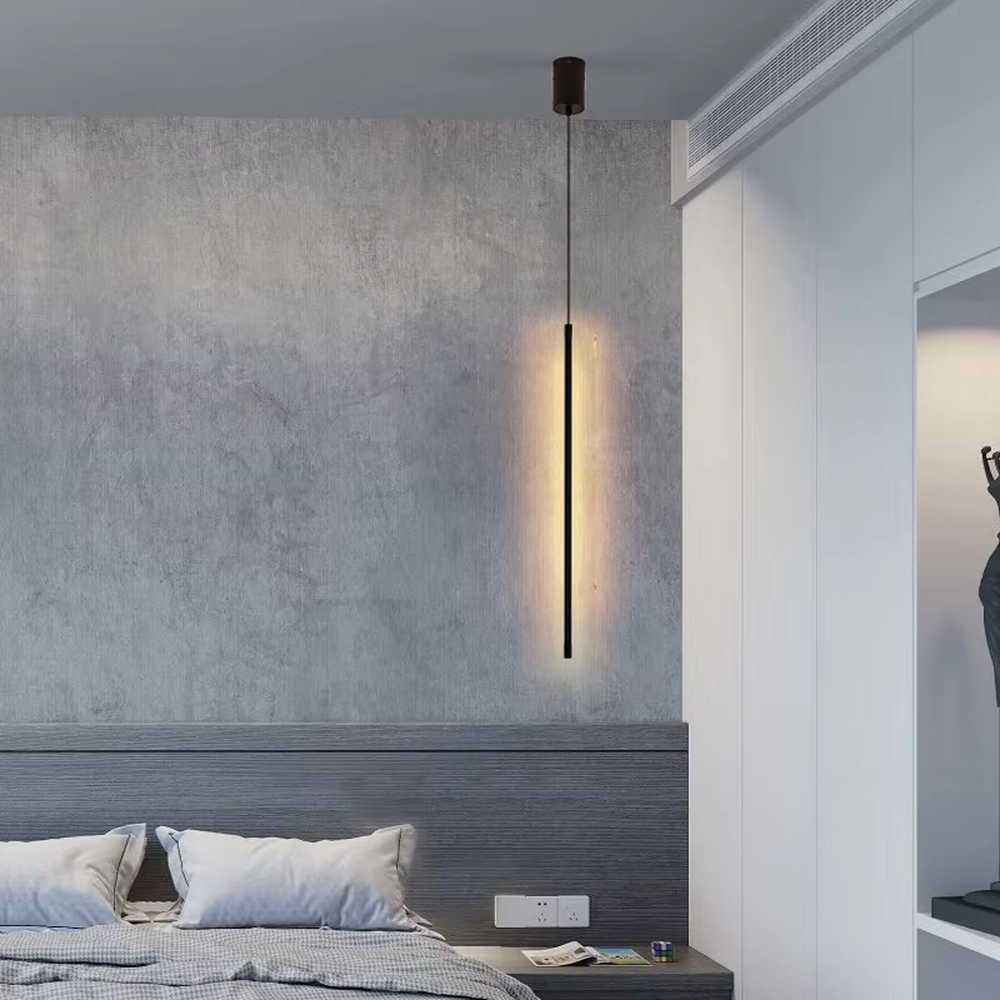 This is a modern minimalist linear pendant light, featuring a slim lamp body crafted from matte black metal, with a staggered hanging design that is simple and neat. It emits soft and uniform light, serving both lighting and decorative purposes, suitable for minimalist entrances, bedroom headboards, light luxury bars, stairwells and other scenarios.