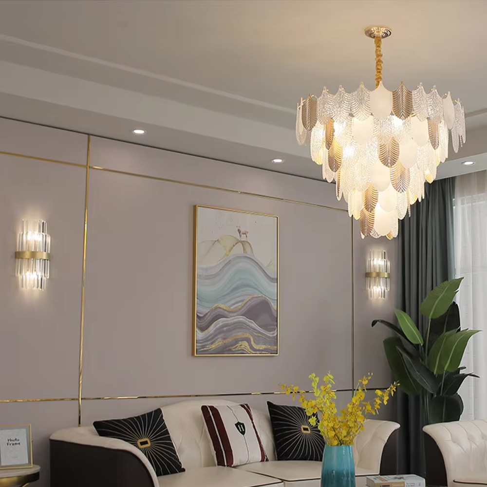 This light luxury leaf crystal chandelier features a gold metal frame paired with leaf-shaped liuli ornaments and drooping crystal tassels, with light refracting a brilliant halo through the crystals, serving both lighting and decorative purposes, suitable for modern light luxury spaces such as living rooms and dining rooms.