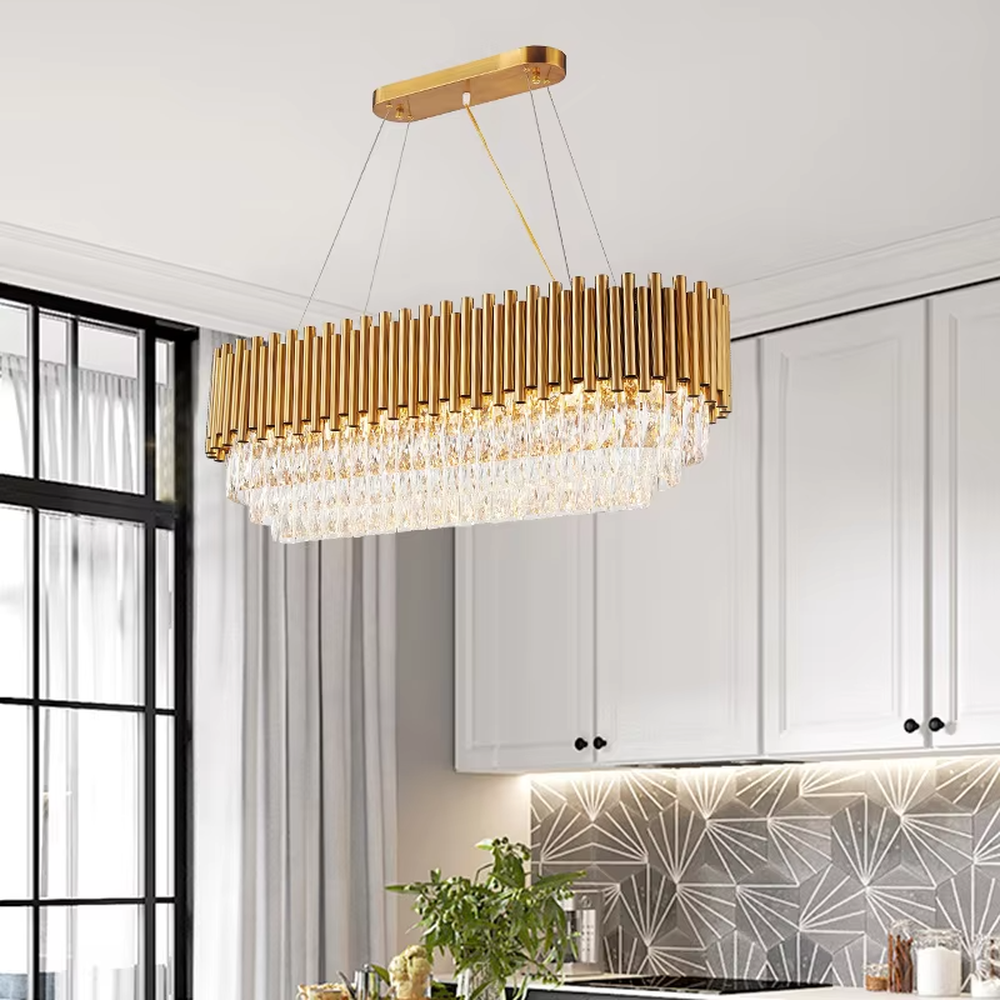This light luxury double-layer oval chandelier consists of upper gold metal vertical strips and lower faceted crystal pendants. Light refracts through the crystals to emit a brilliant glow, serving both lighting and decorative purposes, suitable for high-end spaces such as villa living rooms and light luxury dining rooms.