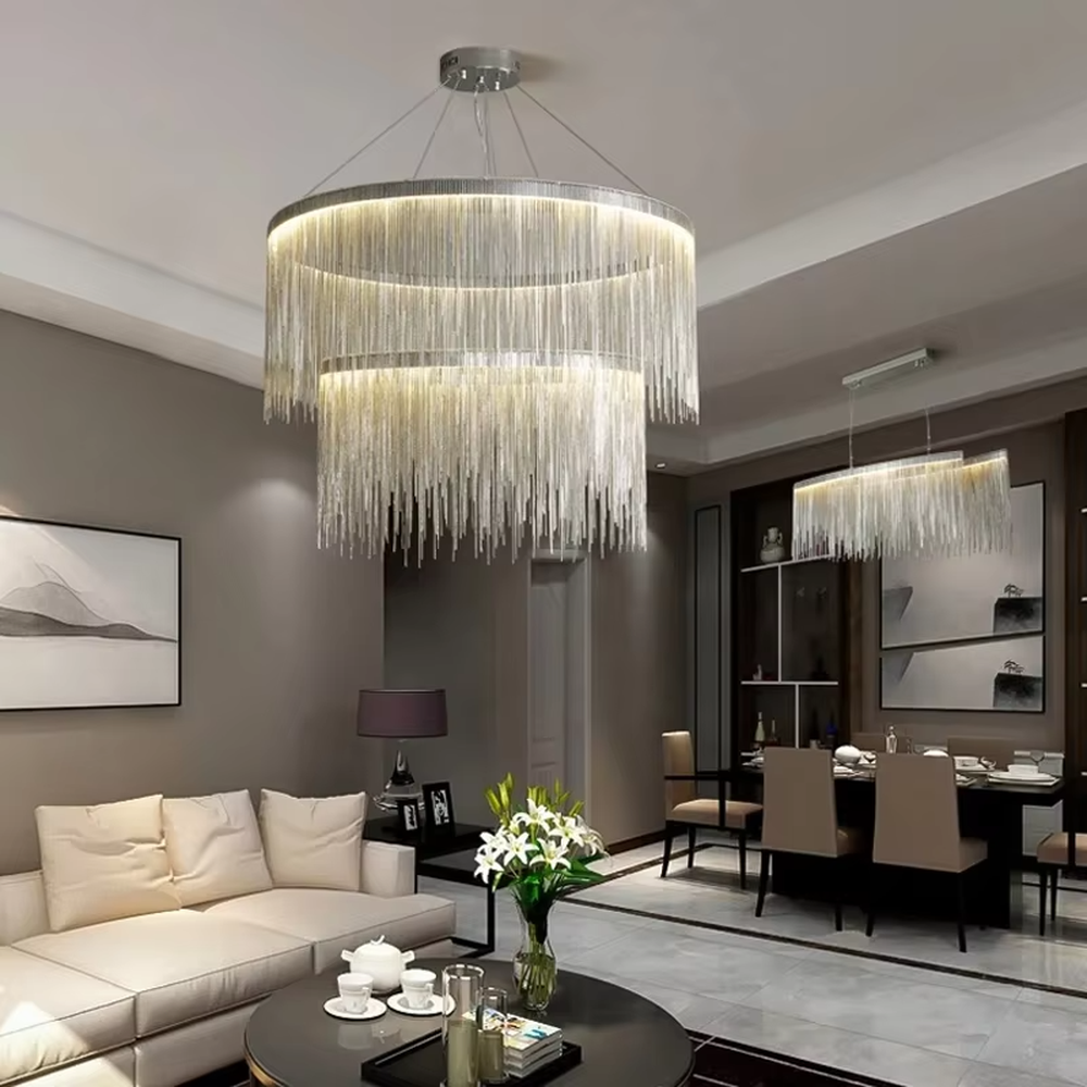 Light luxury metal tassel chandelier, crafted with copper-gold metal strips to create a cascading tassel shape. Light passes through the metal strips to produce a warm, layered lighting effect, making it a high-end decorative lighting fixture that combines artistry and ambiance.