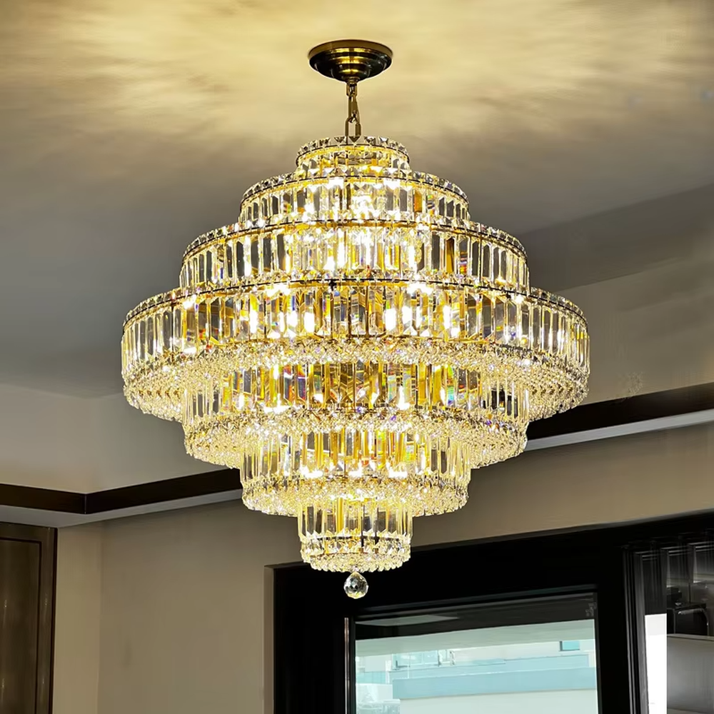 This is a luxurious multi-layer pagoda-shaped crystal chandelier, supported by a gold metal frame with high-transparency crystal strips, creating a brilliant and dazzling light effect through staggered layers, with both decorative and lighting functions, ideal for high-end indoor spaces such as villa living rooms and hotel lobbies.