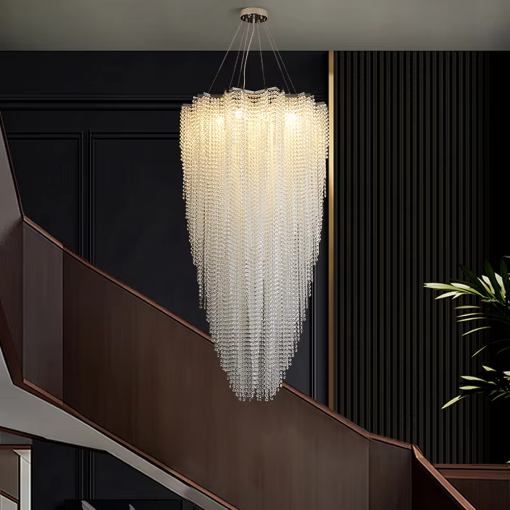 This light luxury heart-shaped crystal chandelier features a full heart shape made of crystal beads, with warm light refracting a brilliant halo through the crystals, serving both lighting and decorative purposes, suitable for modern light luxury spaces such as living rooms and dining rooms.