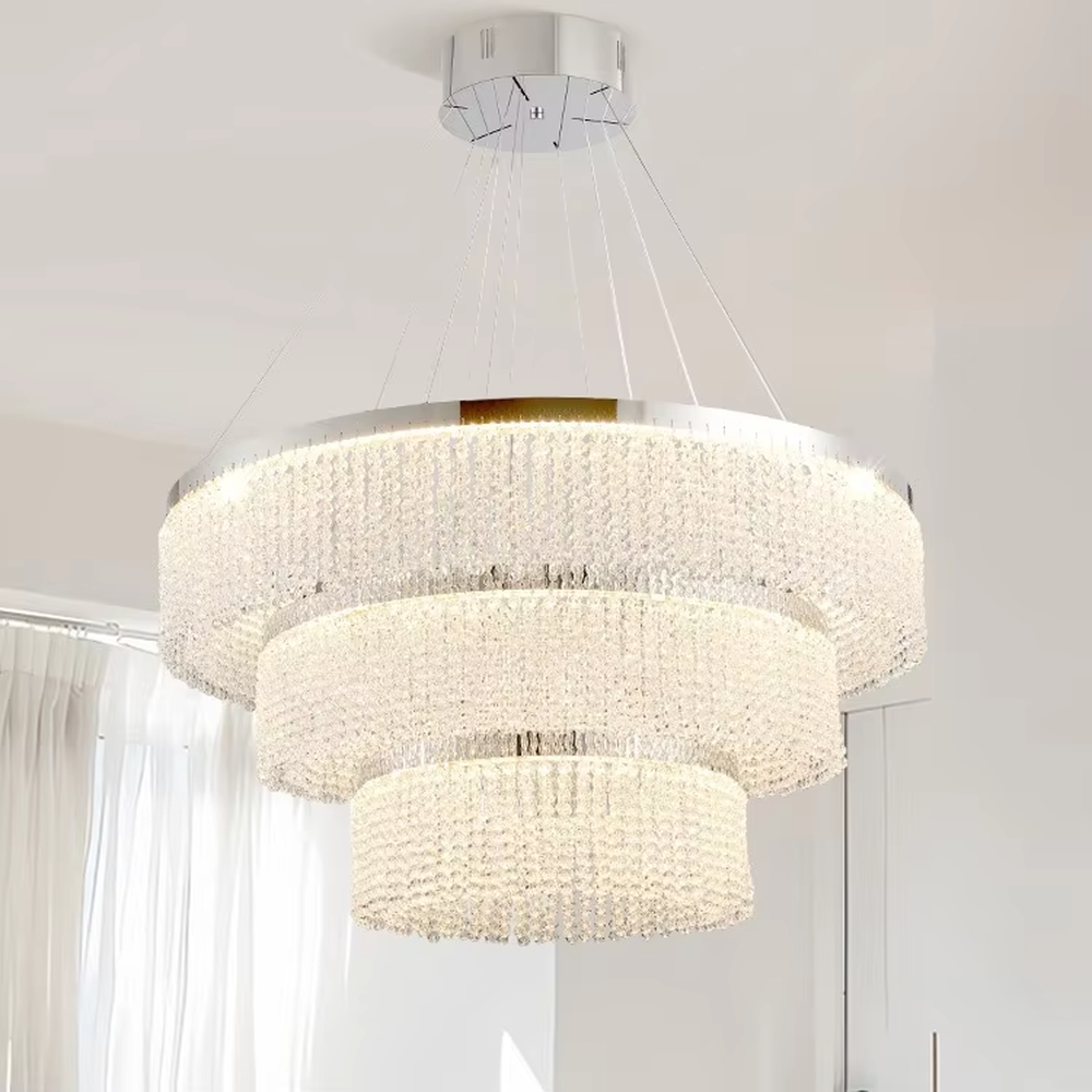 Modern light luxury double-ring spiral crystal chandelier, composed of dense crystal particles and a silver metal frame, presenting a flowing spiral shape. It emits brilliant and soft light, combining artistic decorativeness and lighting function, suitable for core lighting and atmosphere creation in living rooms, dining rooms, villa high-ceiling spaces, etc.
