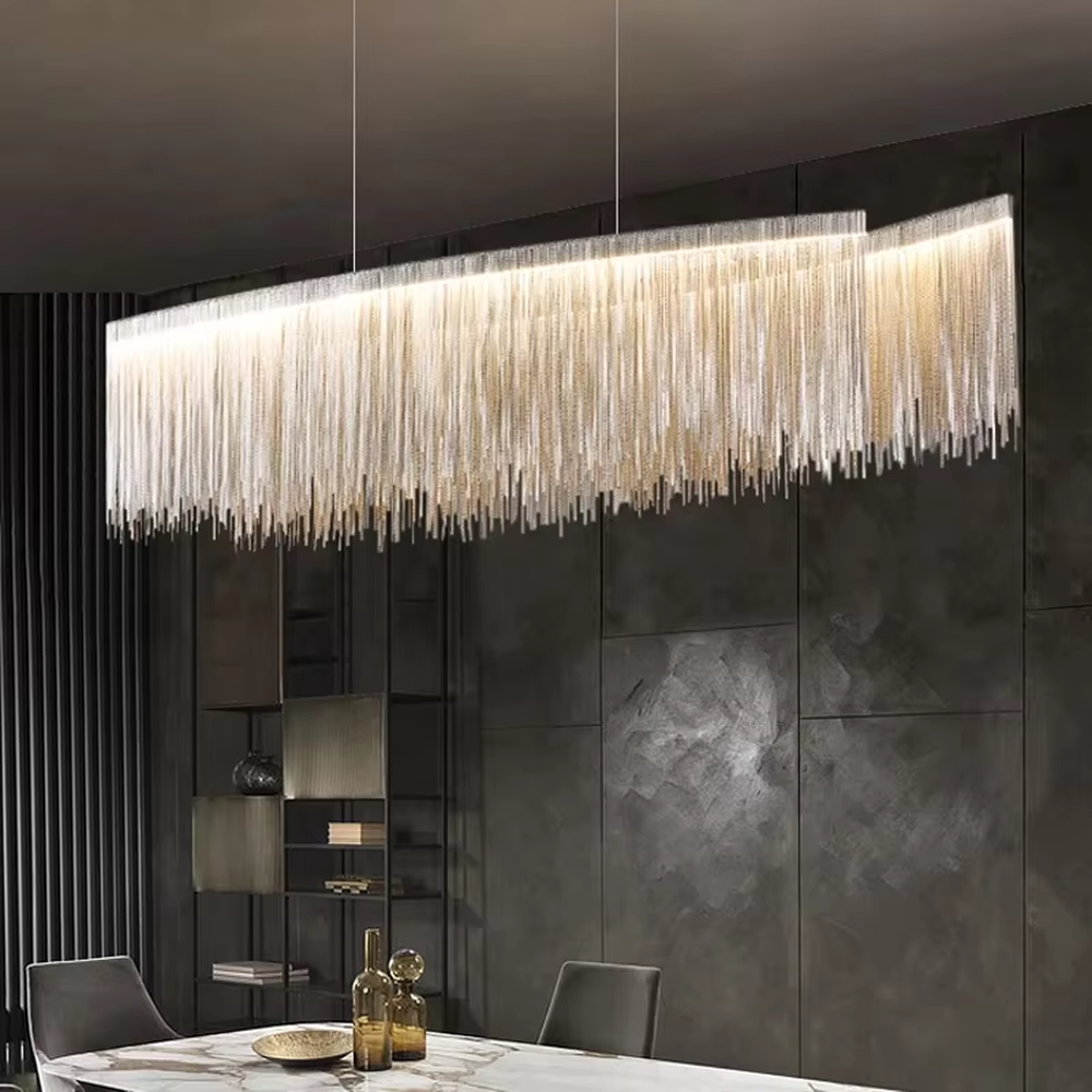 Light luxury metal tassel chandelier, crafted with copper-gold metal strips to create a cascading tassel shape. Light passes through the metal strips to produce a warm, layered lighting effect, making it a high-end decorative lighting fixture that combines artistry and ambiance.