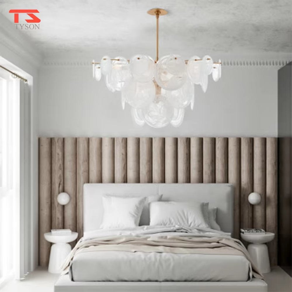 French light luxury glass cloud chandelier, with a golden metal frame paired with transparent glass sheets stacked into a fluffy cloud shape, featuring soft and transparent light, combining decorative and lighting functions, suitable for bedrooms, living rooms, light luxury style spaces.