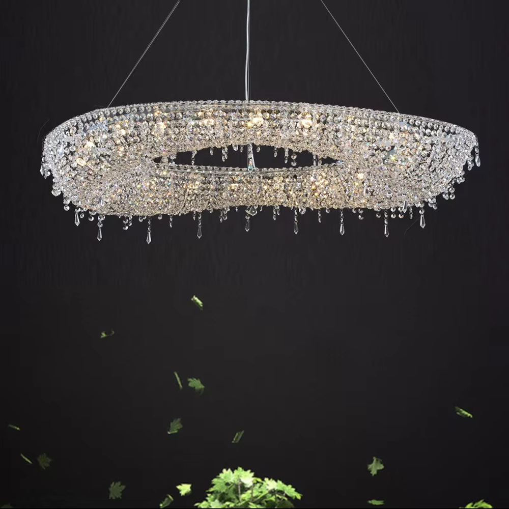 Modern art double-ring streamlined crystal chandelier, with dense crystal particles forming a flowing cloud pattern with staggered double rings, emitting brilliant and transparent light, combining artistic decorativeness and lighting function, suitable for core lighting and atmosphere creation in large spaces such as high-ceiling living rooms, villa hollow areas, and high-end clubs.