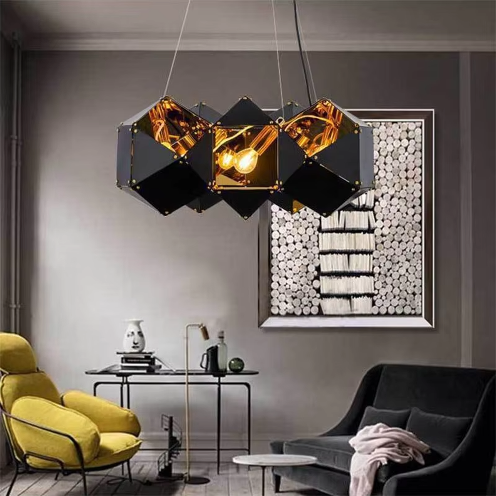 A modern industrial light luxury style geometric splicing chandelier, featuring a black metal polyhedron frame paired with amber glass facets and gold rivet decorations. When lit, the light refracts to create a brilliant effect, combining decorative appeal with practical illumination, ideal for creating a bold and avant-garde space atmosphere.