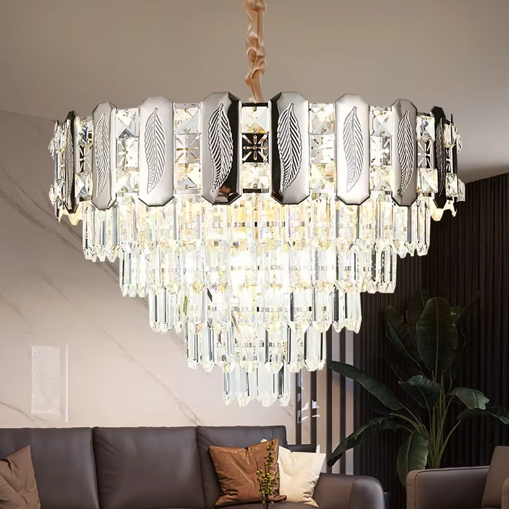This is a light luxury cascading crystal chandelier, with a top metal frame inlaid with leaf-textured decorative panels and cut crystals, and densely cascading crystal strips hanging below, featuring brilliant and soft light, both decorative and lighting functions, ideal for high-end indoor spaces such as living rooms and dining rooms.