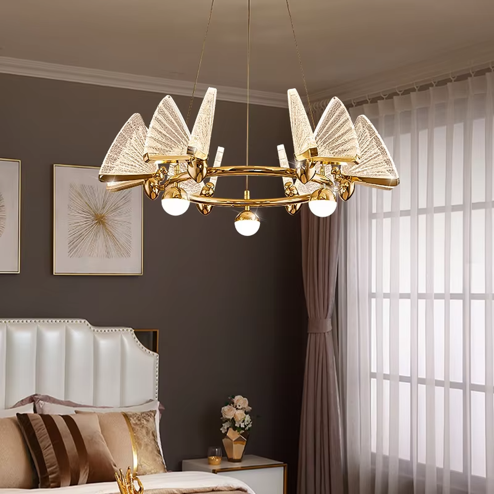 This is a light luxury artistic butterfly wing chandelier, featuring a gold metal circular frame paired with colorful gold glass butterfly wing decorations, with built-in spherical light sources. It emits brilliant and dynamic light, serving both lighting and decorative purposes, suitable for light luxury living rooms, dining rooms, high-end clubs, showrooms and other scenarios.