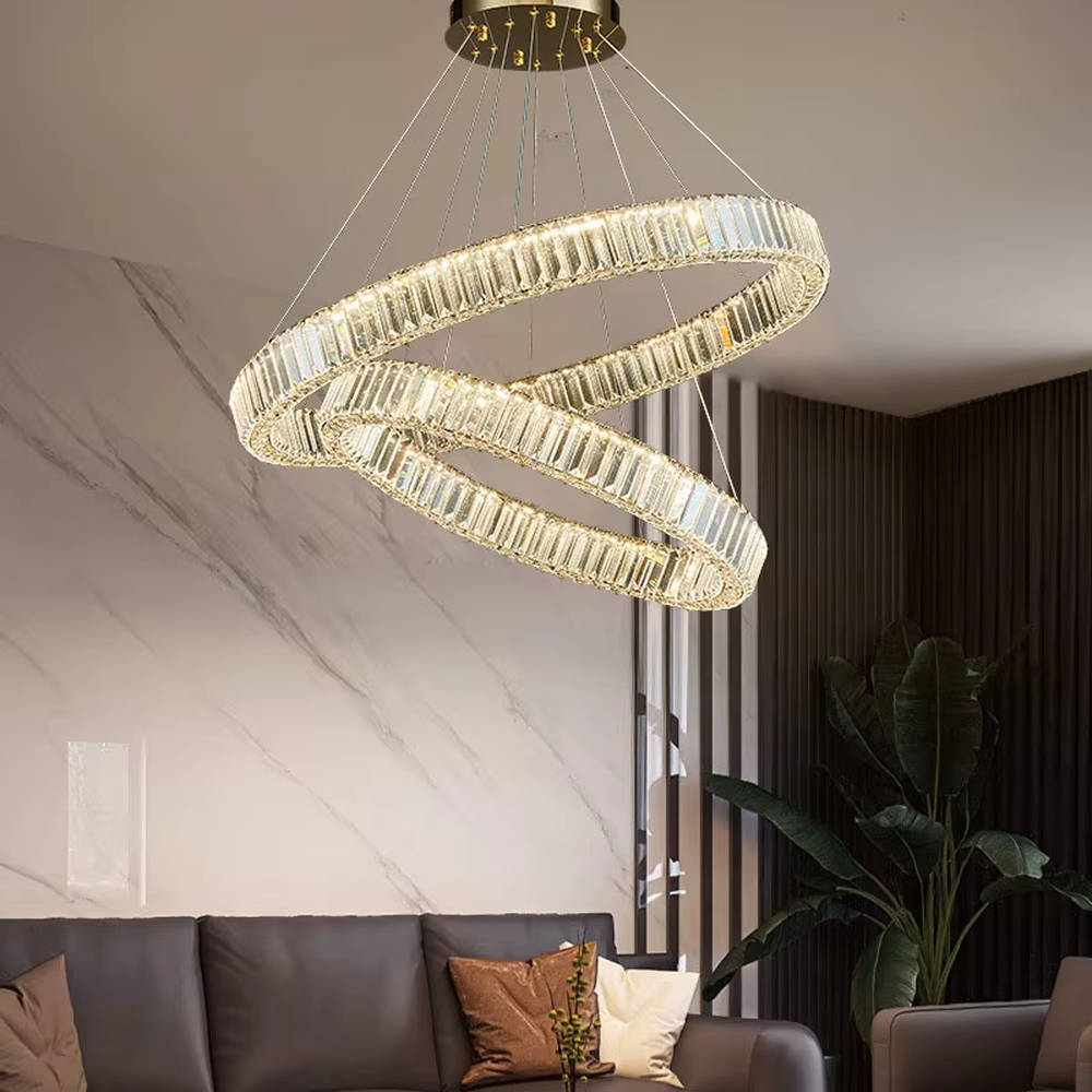 This is a light luxury double-layer spiral ring crystal chandelier, with a gold metal frame inlaid with high-transparency crystal strips, presenting a dynamic staggered ring structure, with brilliant and soft light, both decorative and lighting functions, ideal for high-end indoor spaces such as living rooms and dining rooms.