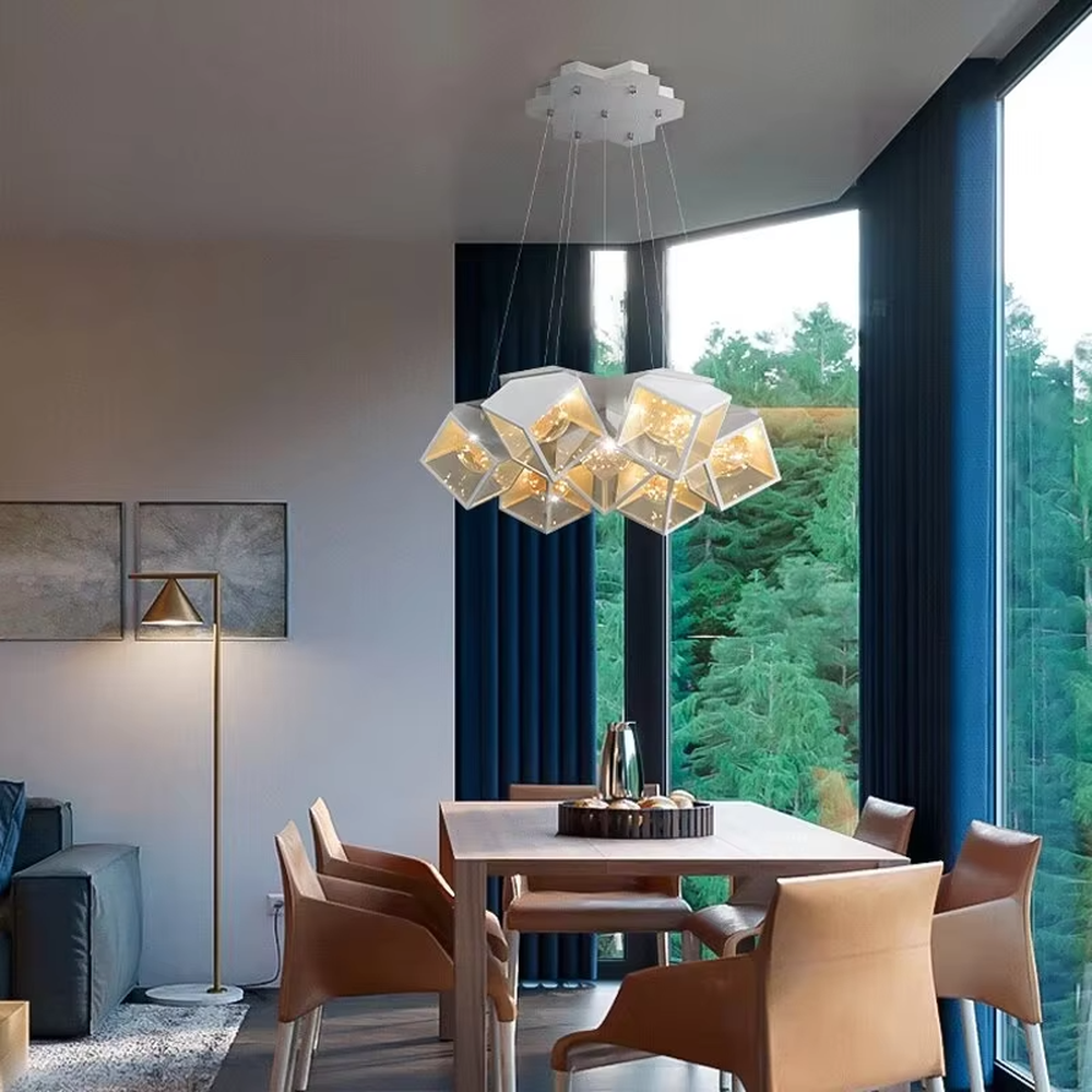 A modern industrial style cluster chandelier, featuring a black metal geometric cube structure with mirrored transparent panels and vintage filament bulbs. Its staggered, interlocking design is highly distinctive, combining decorative appeal with practical illumination, ideal for creating a bold and avant-garde space atmosphere.