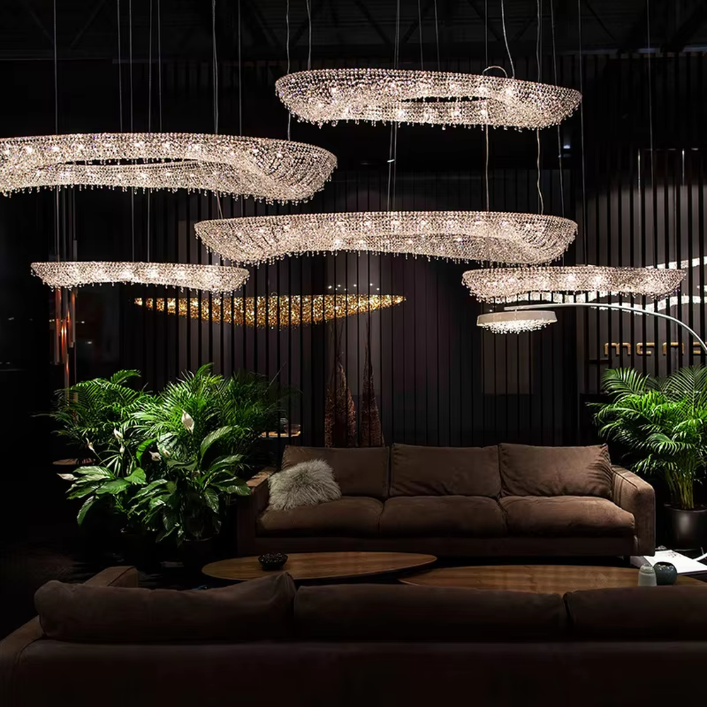 Modern art double-ring streamlined crystal chandelier, with dense crystal particles forming a flowing cloud pattern with staggered double rings, emitting brilliant and transparent light, combining artistic decorativeness and lighting function, suitable for core lighting and atmosphere creation in large spaces such as high-ceiling living rooms, villa hollow areas, and high-end clubs.