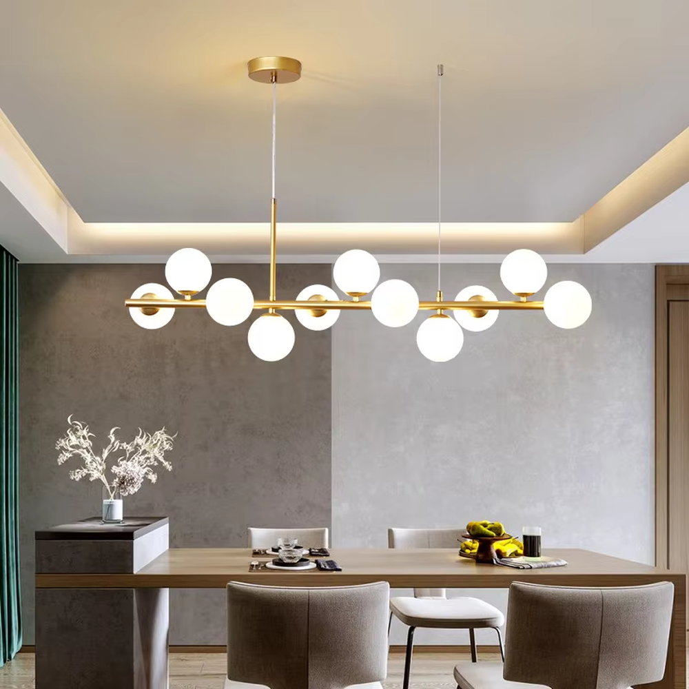Modern light luxury golden linear molecular ball chandelier, with a golden metal frame paired with staggered milky white glass ball lampshades, featuring soft and uniform light, combining decorative and lighting functions, suitable for dining rooms, bars, open kitchens and other modern style spaces.
