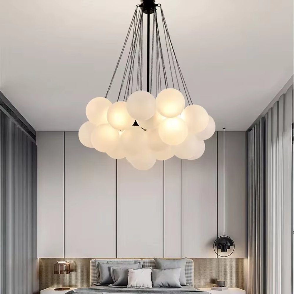 Modern light luxury cloud-shaped chandelier, with a golden metal frame and milky white glass ball lampshades stacked into a full cloud shape, featuring soft and warm light, combining decorative and lighting functions, suitable for living rooms, dining rooms, bedrooms and other modern style spaces.