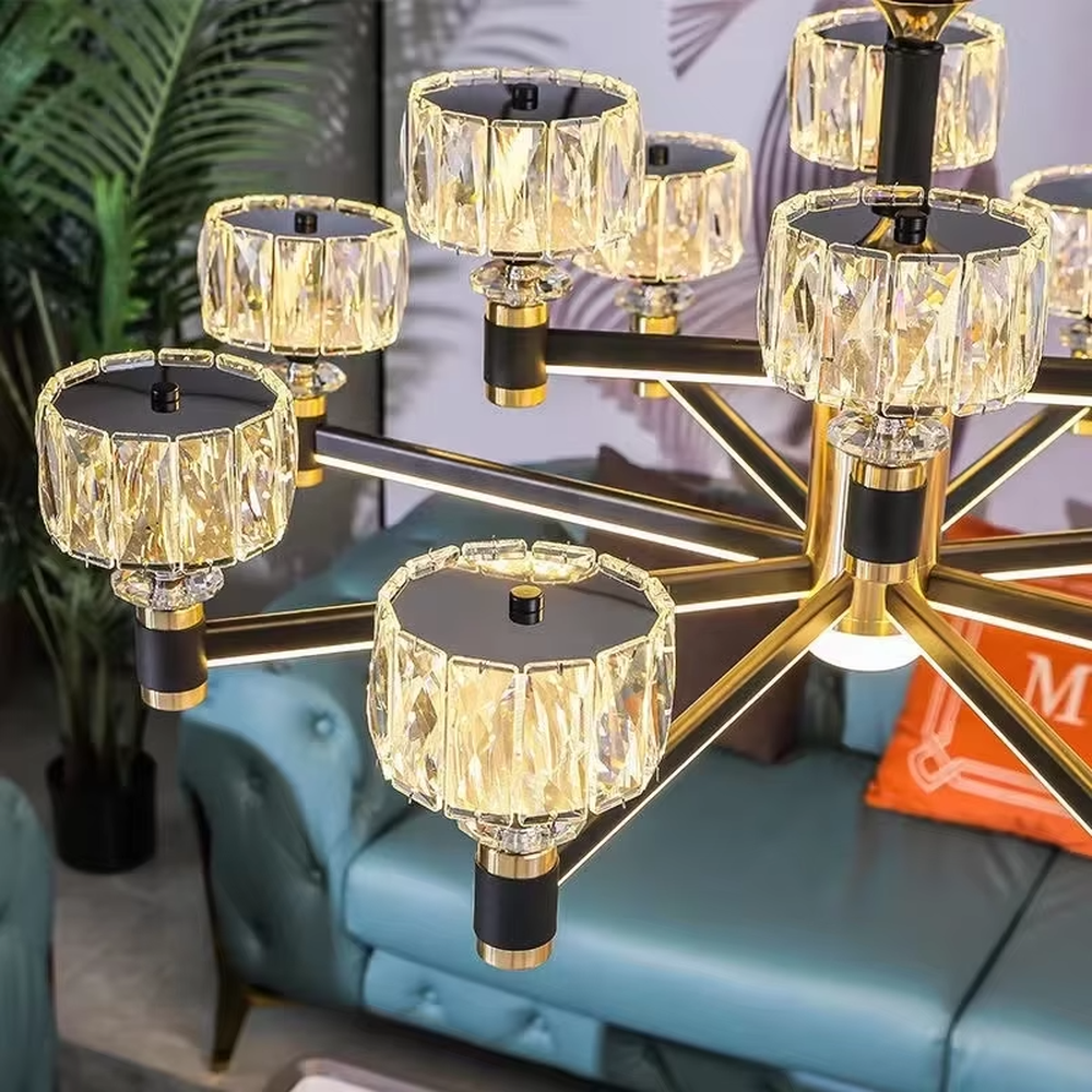A modern light luxury style multi-head chandelier, featuring a gold metal frame paired with cut-texture crystal glass lampshades, with an additional auxiliary light source in the center. It emits a brilliant and soft glow when lit, combining decorative appeal with practical illumination, ideal for creating an exquisite and high-end space atmosphere.