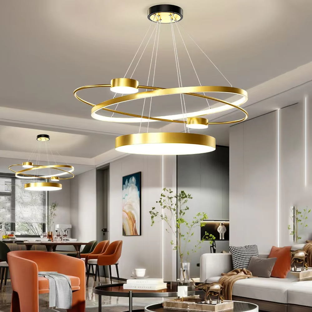 A modern light luxury multi-layer ring floating chandelier, featuring a golden metal ring structure paired with LED light strips and a bottom circular luminous panel. It has an adjustable suspension rod design, combining lighting and decorative functions, ideal for creating an elegant and high-end space atmosphere.