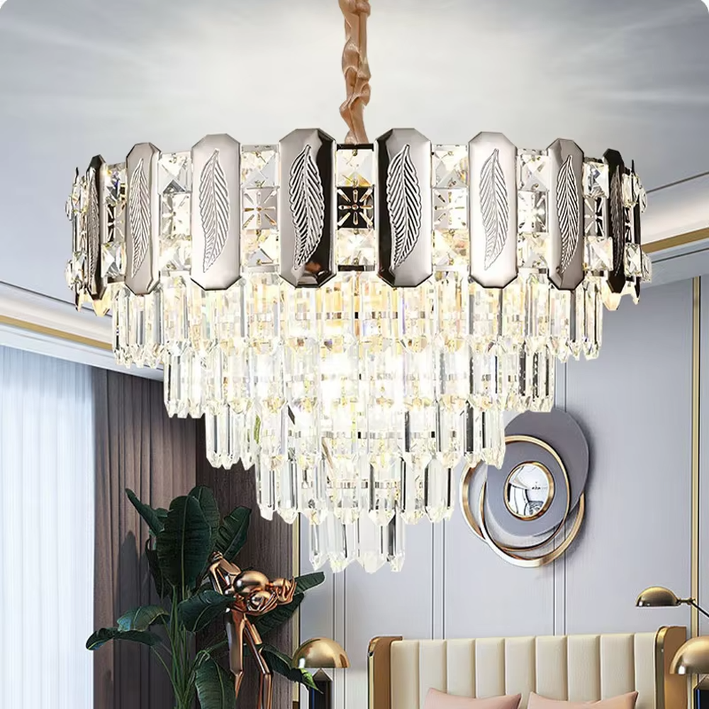 This is a light luxury cascading crystal chandelier, with a top metal frame inlaid with leaf-textured decorative panels and cut crystals, and densely cascading crystal strips hanging below, featuring brilliant and soft light, both decorative and lighting functions, ideal for high-end indoor spaces such as living rooms and dining rooms.