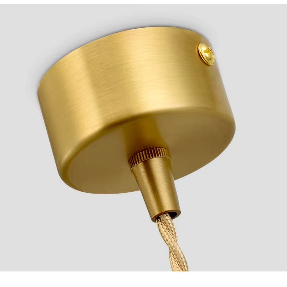 This is a modern light luxury gold cylindrical triple-head pendant light, featuring a linear bronze metal base paired with cylindrical lamp bodies, with a staggered hanging design that is simple and neat. It emits soft and uniform light, serving both lighting and decorative purposes, suitable for dining rooms, bars, minimalist living rooms and other scenarios.