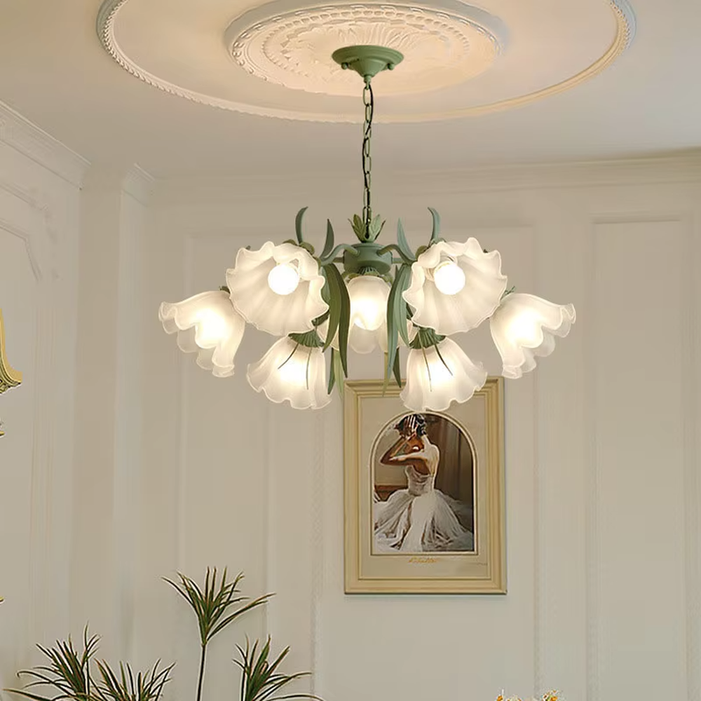 This French pastoral style flower chandelier features a green metal branch paired with white flower-shaped lampshades, with light refracting a soft halo through the frosted lampshades, serving both lighting and decorative purposes, suitable for warm and romantic spaces such as bedrooms and dining rooms.