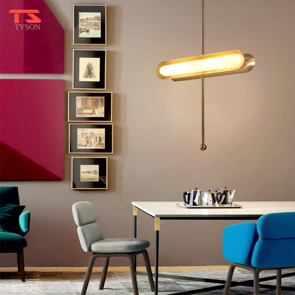 This is a modern light luxury cross-shaped artistic pendant light, featuring a bronze metal frame paired with an oval soft light-emitting lamp body, with simple and balanced lines, serving both lighting and decorative purposes, suitable for entrances, bedroom headboards, light luxury bars, minimalist living rooms and other scenarios.