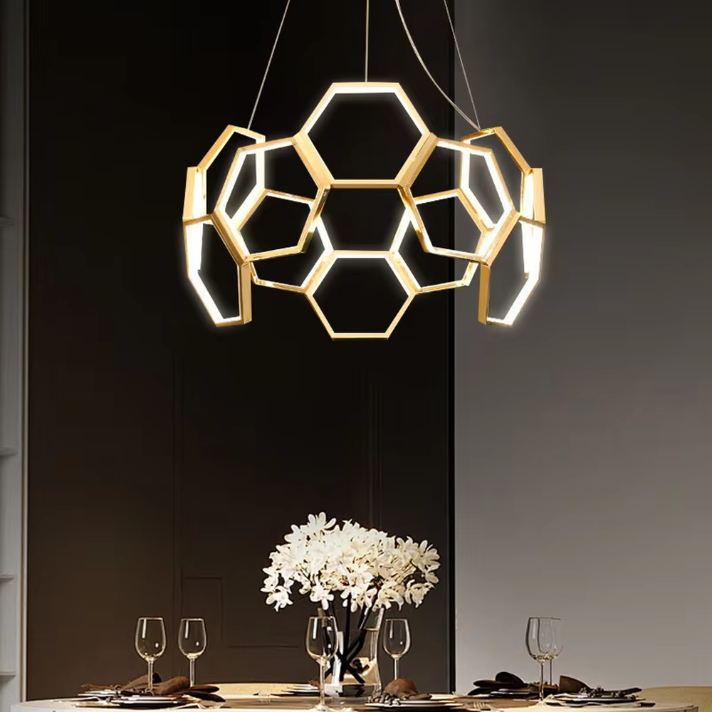 A modern light luxury style honeycomb-shaped chandelier, featuring a honeycomb geometric frame made of gold metal with built-in LED strips. It emits soft and uniform light when lit, combining artistic decoration with lighting functionality, ideal for creating a high-end and futuristic space atmosphere.
