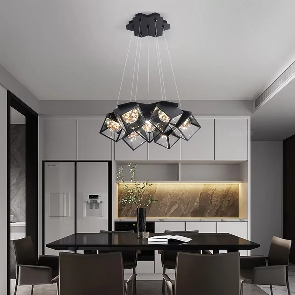A modern industrial style cluster chandelier, featuring a black metal geometric cube structure with mirrored transparent panels and vintage filament bulbs. Its staggered, interlocking design is highly distinctive, combining decorative appeal with practical illumination, ideal for creating a bold and avant-garde space atmosphere.
