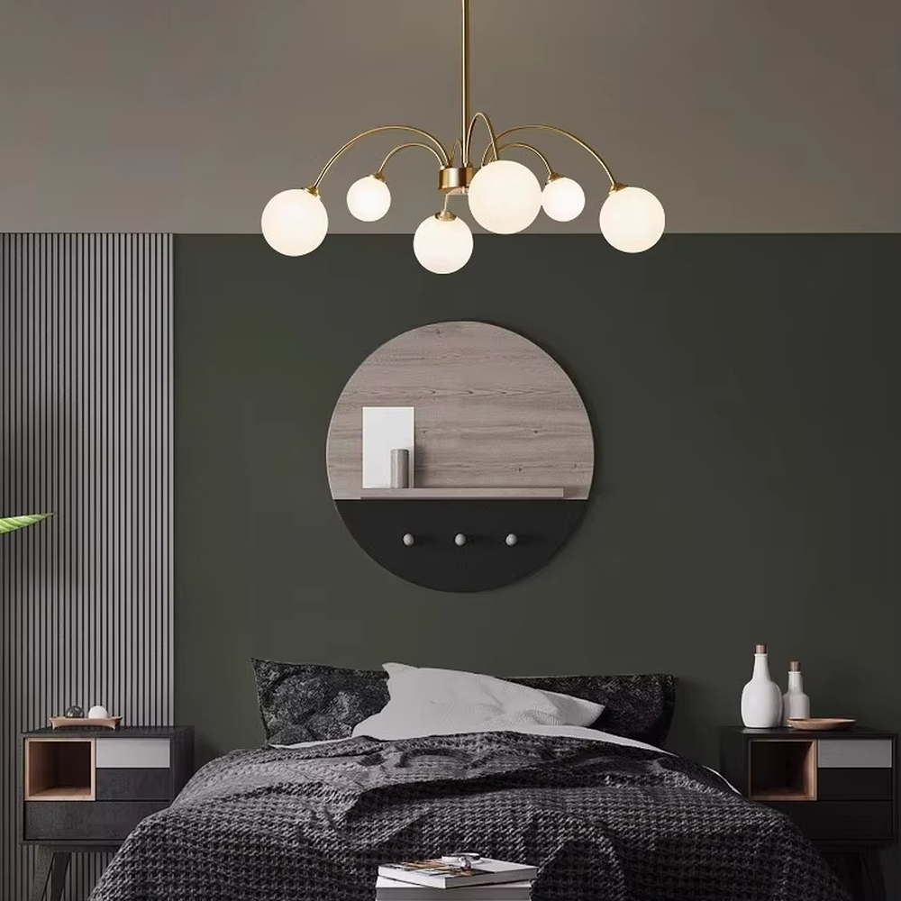 A modern light luxury style firefly chandelier, featuring a gold metal curved branch frame paired with multiple milky white glass glowing spheres of varying sizes, shaped like a blooming dandelion or flying fireflies. It emits a soft and uniform glow when lit, combining decorative appeal with practical illumination, ideal for creating a romantic and dynamic space atmosphere.