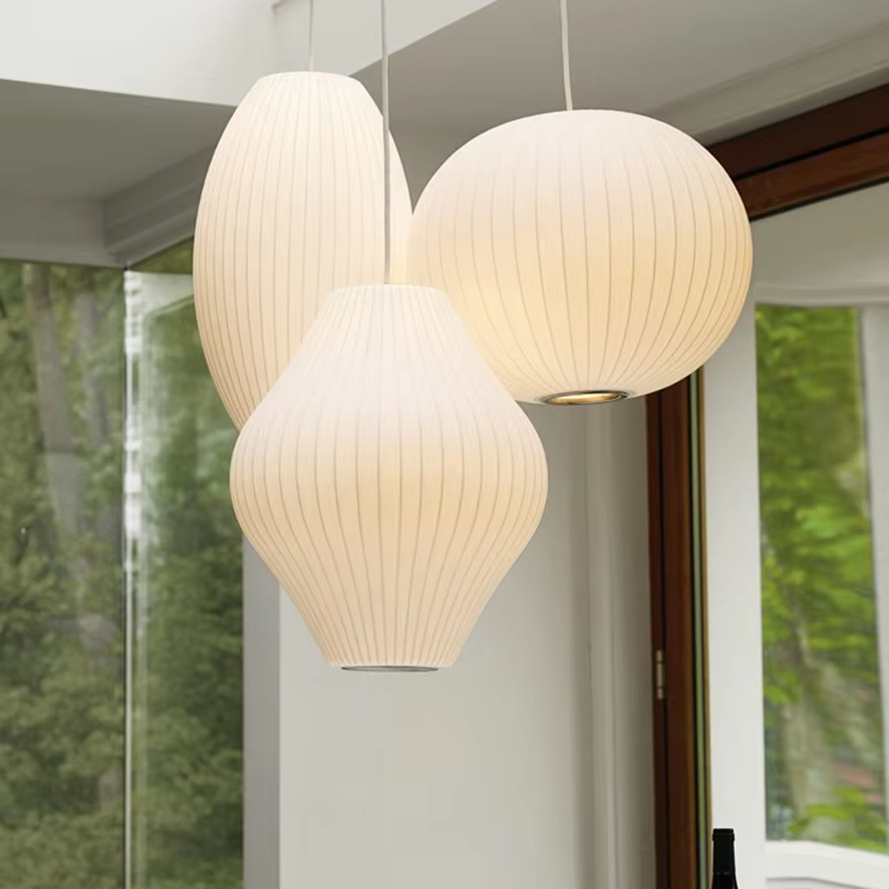This is a set of modern minimalist multi-shaped pleated fabric chandeliers, composed of off-white pleated lampshades in different shapes such as ellipse, flying saucer and flower bud, which has both soft lighting and artistic decoration functions, suitable for living rooms, dining rooms, B&Bs, cafes and other spaces.