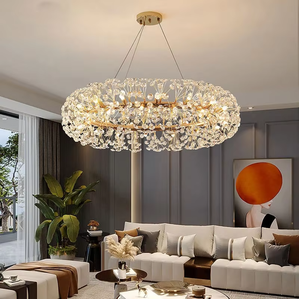 Modern light luxury starry sky oval crystal chandelier, featuring a gold metal frame covered with transparent crystal ornaments. Light refracts through the crystals to create a brilliant glow, combining luxury texture and artistic ambiance, making it a high-end decorative lighting fixture that elevates the space's style.