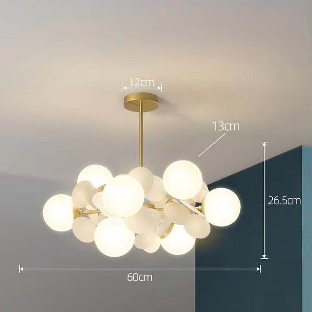 A modern art style branch chandelier, featuring a gold metal frame paired with colorful matte discs and milky white glowing spheres. It emits a soft and warm glow when lit, combining decorative appeal with practical illumination, ideal for creating a lively and soothing space atmosphere.