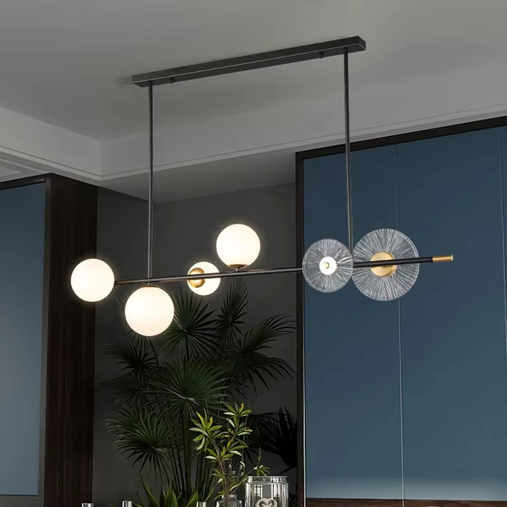 Modern light luxury black-gold contrasting linear chandelier, with a black metal frame paired with milky white glass ball lampshades and radial-pattern glass discs, featuring a minimalist and layered design, soft and uniform light, combining decorative and lighting functions, suitable for dining rooms, bars, open living rooms and other modern style spaces.