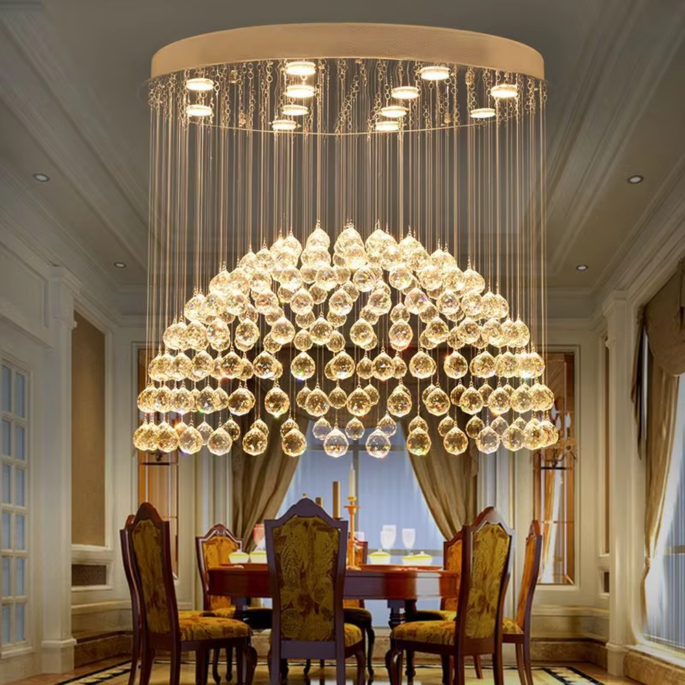 This light luxury crystal ball pendant chandelier features a circular metal base paired with metal wires and dense crystal balls, forming a full spherical shape, with dazzling light, serving both lighting and decorative purposes, suitable for high-end residential spaces such as high-ceiling living rooms and villas.