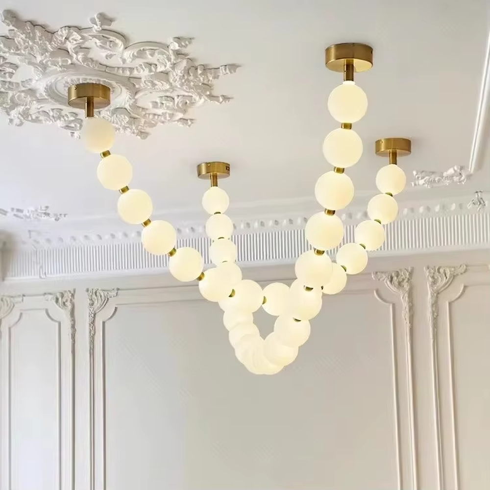 Modern Light Luxury Curved Beaded Chandelier, Milk White Spherical Lampshades Connected in a Wave Shape, Gold Metal Base, Serves Both Lighting and Decorative Purposes, Ideal for Living Rooms, Dining Rooms, Open Kitchens, etc.