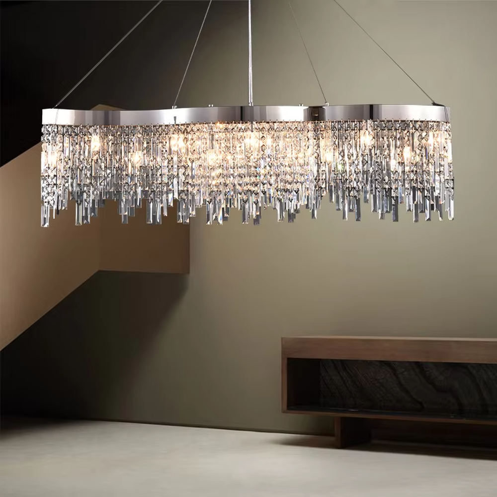 This light luxury tassel crystal chandelier features a circular tassel shape made of a metal frame and multi-layer faceted crystal strips, with light refracting a brilliant halo through the crystals, serving both lighting and decorative purposes, suitable for modern light luxury spaces such as living rooms and dining rooms.