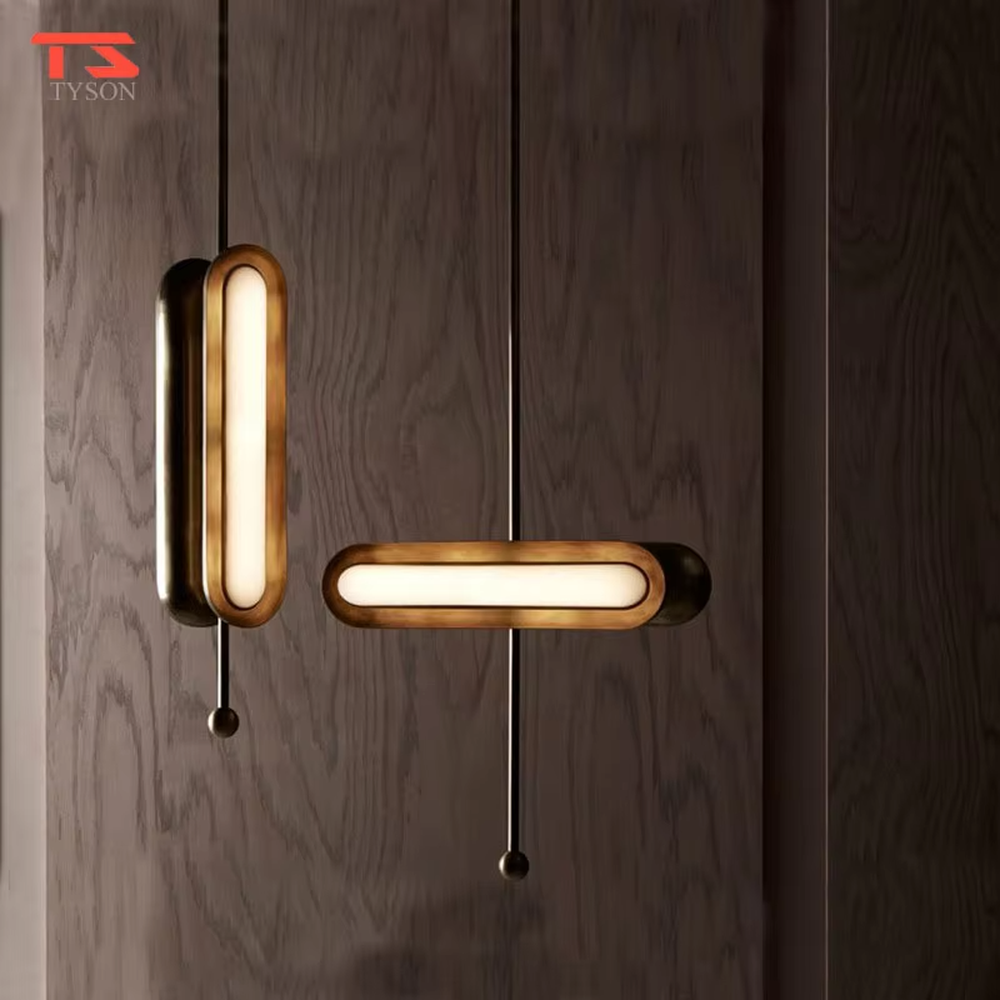 This is a modern light luxury cross-shaped artistic pendant light, featuring a bronze metal frame paired with an oval soft light-emitting lamp body, with simple and balanced lines, serving both lighting and decorative purposes, suitable for entrances, bedroom headboards, light luxury bars, minimalist living rooms and other scenarios.