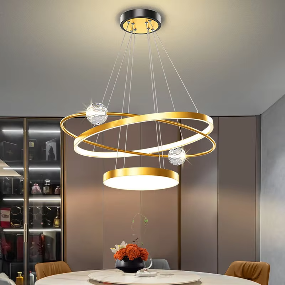A modern light luxury multi-layer ring floating chandelier, featuring a golden metal ring structure paired with LED light strips and a bottom circular luminous panel. It has an adjustable suspension rod design, combining lighting and decorative functions, ideal for creating an elegant and high-end space atmosphere.