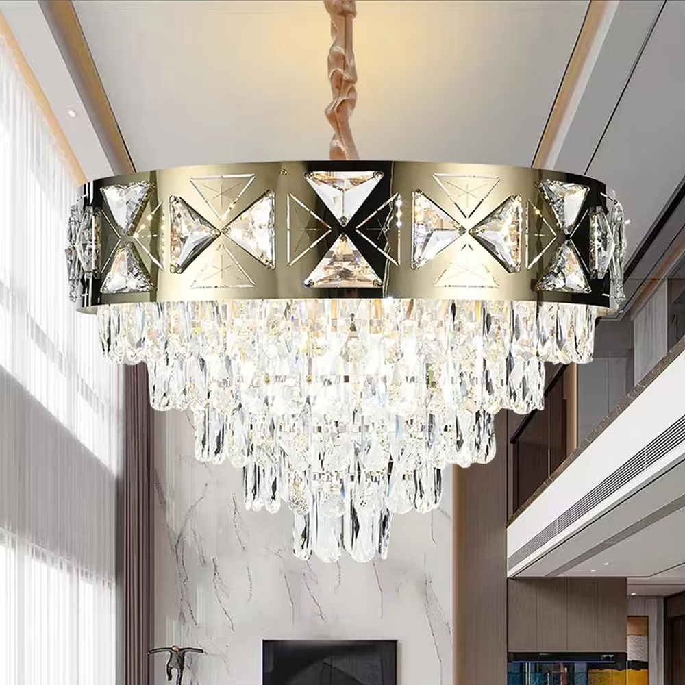 This is a luxurious round crystal chandelier, with a gold metal frame inlaid with cut crystal decorations, and cascading crystal strips hanging below, featuring brilliant and soft light, both decorative and lighting functions, ideal for high-end indoor spaces such as living rooms and dining rooms.