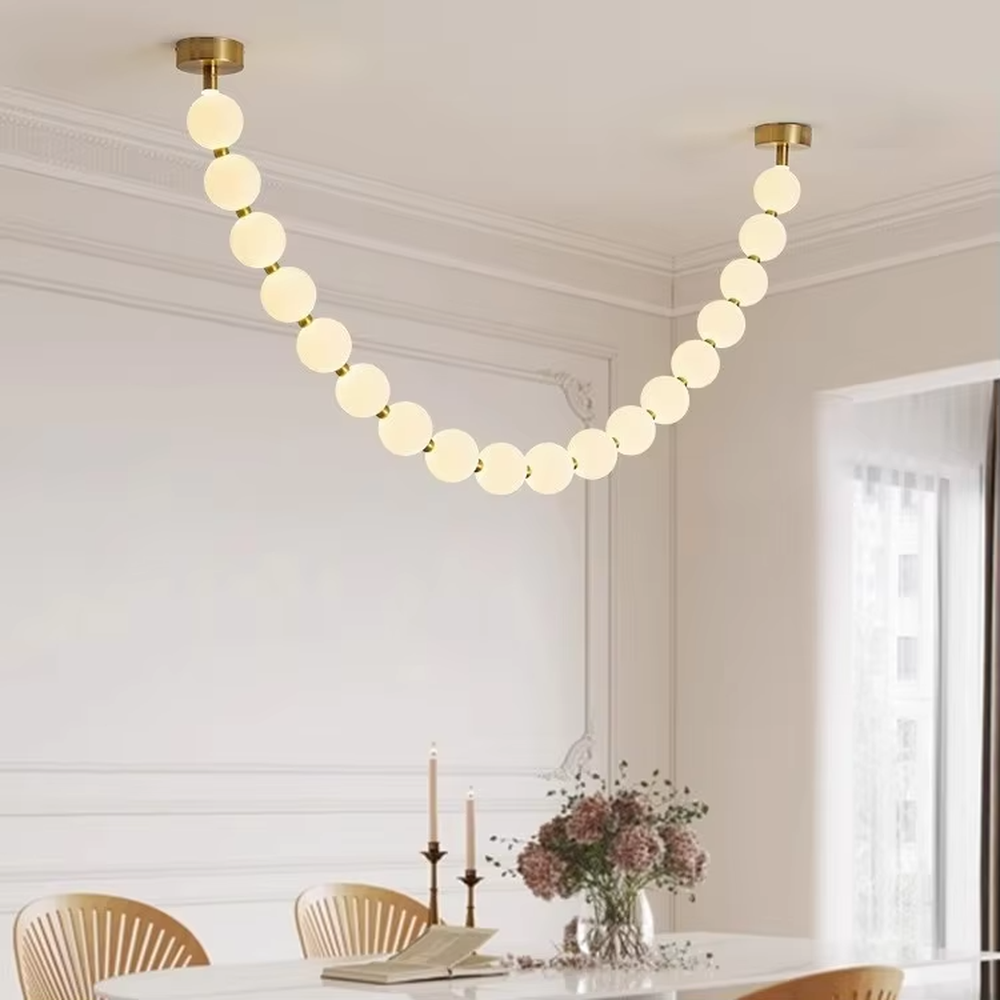 Modern Light Luxury Curved Beaded Chandelier, Milk White Spherical Lampshades Connected in a Wave Shape, Gold Metal Base, Serves Both Lighting and Decorative Purposes, Ideal for Living Rooms, Dining Rooms, Open Kitchens, etc.