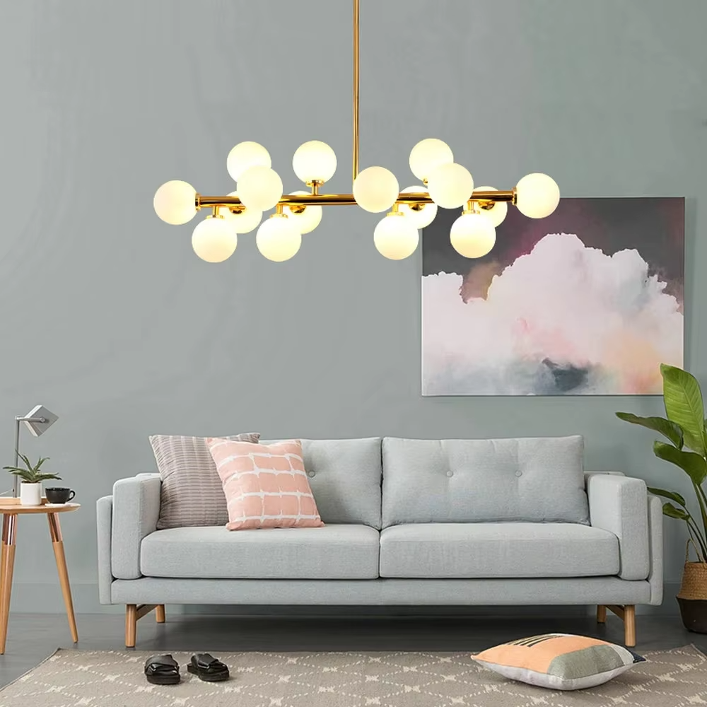 A modern light luxury style linear molecular ball chandelier, featuring a gold metal frame paired with multiple milky white glass glowing spheres of varying sizes, shaped like a star cluster or molecular structure suspended in space. It emits a soft and uniform glow when lit, combining decorative appeal with practical illumination, ideal for creating a minimalist and sophisticated space atmosphere.