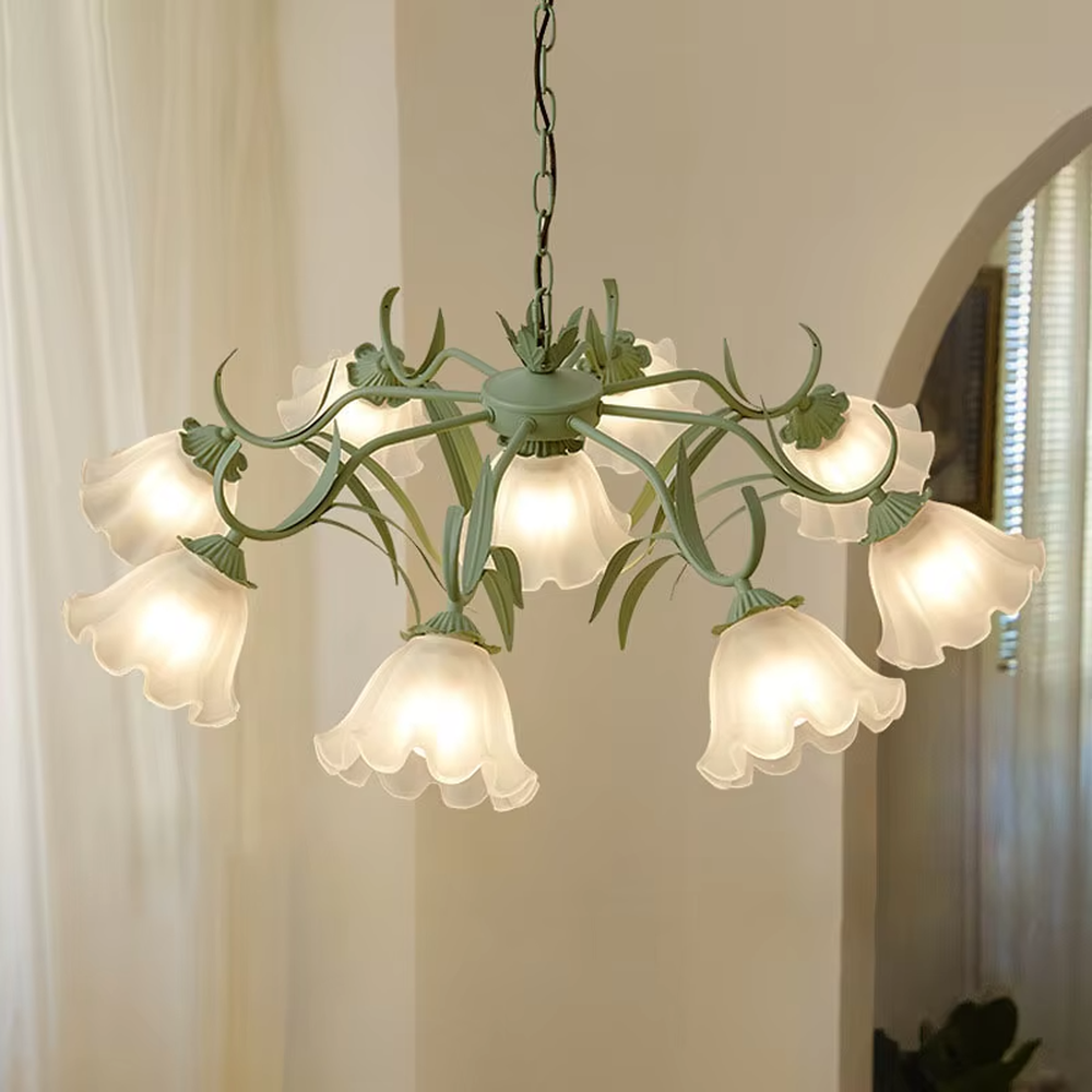 This French pastoral style flower chandelier features a green metal branch paired with white flower-shaped lampshades, with light refracting a soft halo through the frosted lampshades, serving both lighting and decorative purposes, suitable for warm and romantic spaces such as bedrooms and dining rooms.