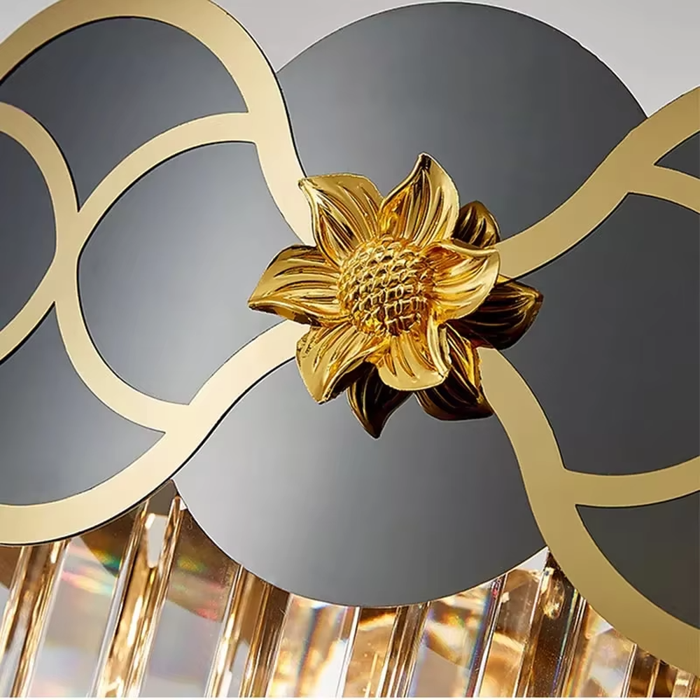 This light luxury black-gold fan-shaped crystal chandelier features a rectangular shape made of a metal frame and crystal tassels, with black-gold contrasting fan-shaped decorations adorned with golden patterns on the top. Light refracts a brilliant halo through the crystals, serving both lighting and decorative purposes, suitable for modern light luxury spaces such as dining rooms and living rooms.