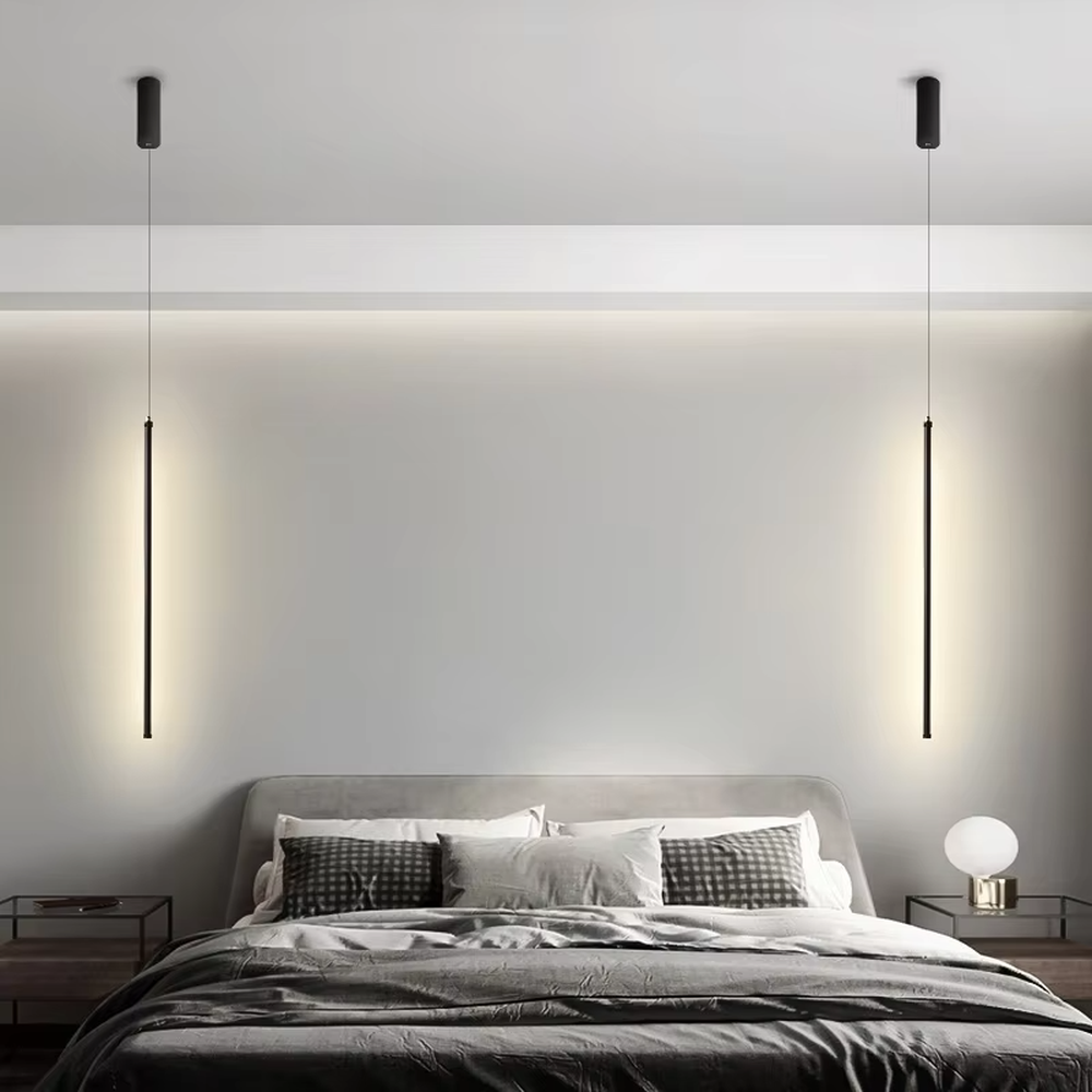 This is a modern minimalist linear pendant light, featuring a slim lamp body crafted from matte black metal, with a staggered hanging design that is simple and neat. It emits soft and uniform light, serving both lighting and decorative purposes, suitable for minimalist entrances, bedroom headboards, light luxury bars, stairwells and other scenarios.