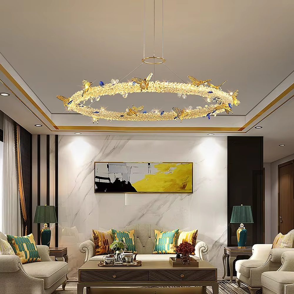 A light luxury and glamorous three-tiered ring chandelier, decorated with crystal gravel, natural blue-veined stone, and gold metal butterflies. Its staggered ring structure resembles flowing cosmic orbits, emitting a brilliant yet soft glow when lit, combining artistic decoration with lighting functionality, ideal for creating a high-end and romantic space atmosphere.