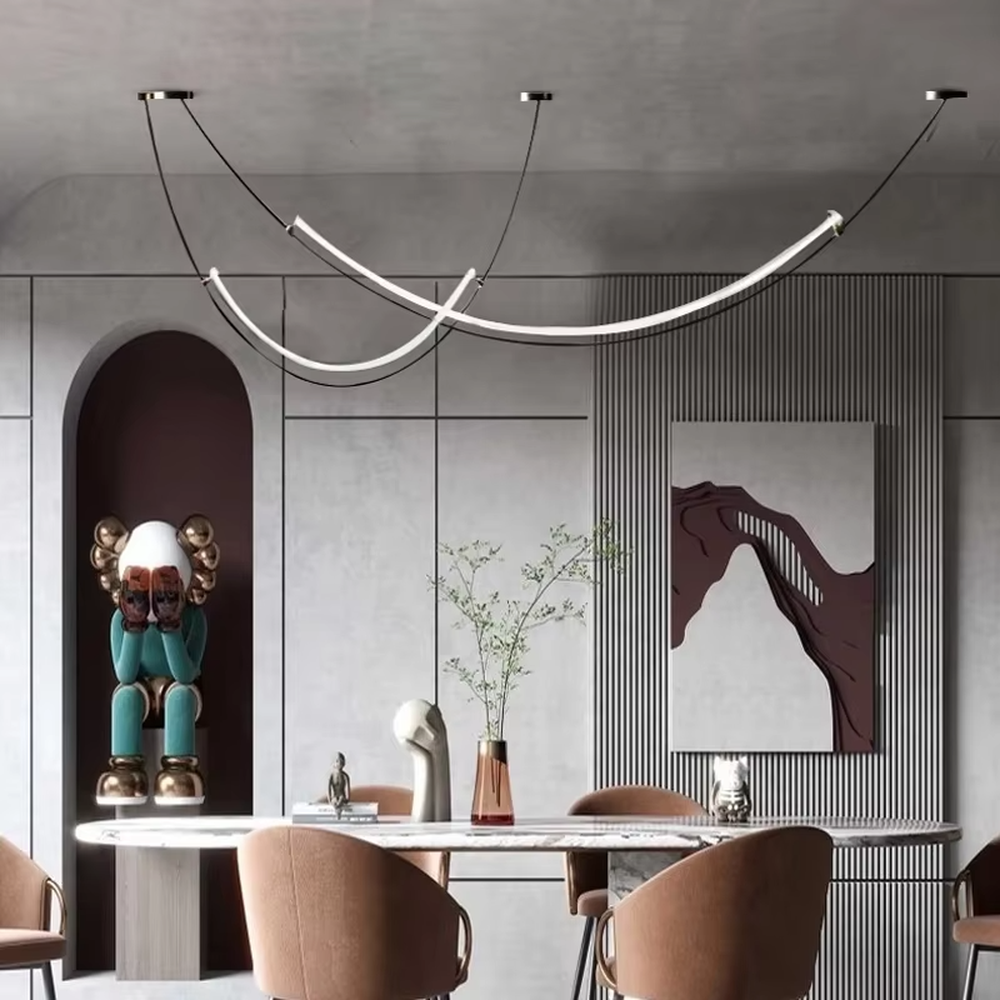 A modern minimalist style double-arc linear chandelier, featuring a black metal frame with built-in white LED light strips, shaped like flowing light arcs suspended in space. It emits a soft and uniform glow when lit, combining decorative appeal with practical illumination, ideal for creating a minimalist and sophisticated space atmosphere.