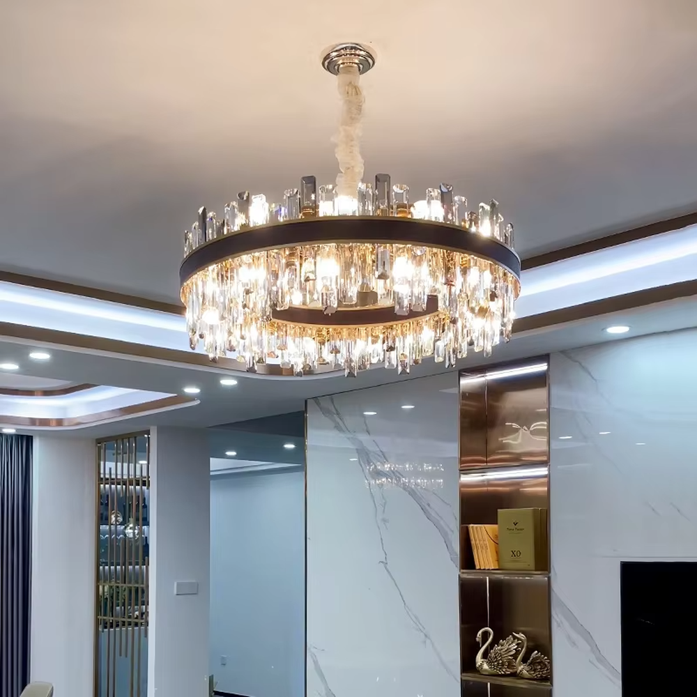 Modern light luxury double-layer ring crystal chandelier, with a golden metal frame and layered transparent crystal strips hanging down, featuring bright and soft light, combining decorative and lighting functions, suitable for living rooms, dining rooms, villas and other light luxury style spaces.
